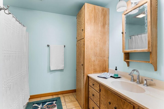 N402 24th Ave, Neshkoro, WI 54960 - bathroom with baseboards, tile patterned flooring, and vanity