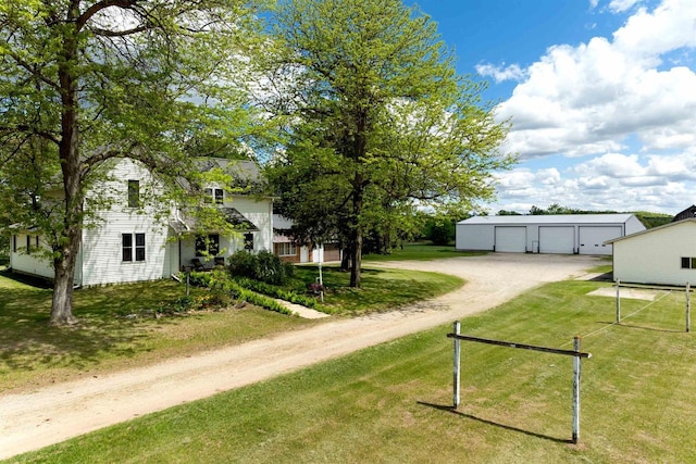 N402 24th Ave, Neshkoro, WI 54960 - exterior space with dirt driveway, an outdoor structure, and a garage