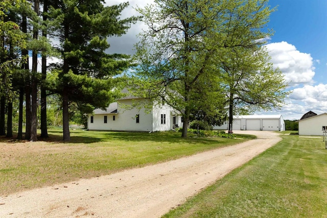 N402 24th Ave, Neshkoro, WI 54960 - view of green lawn featuring an outbuilding, a detached garage, and driveway