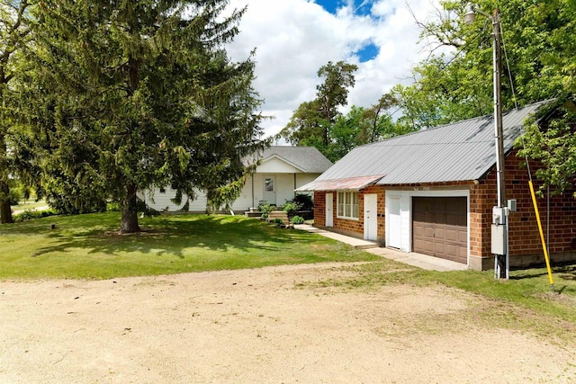 N402 24th Ave, Neshkoro, WI 54960 - view of front of house with a front lawn, driveway, and metal roof
