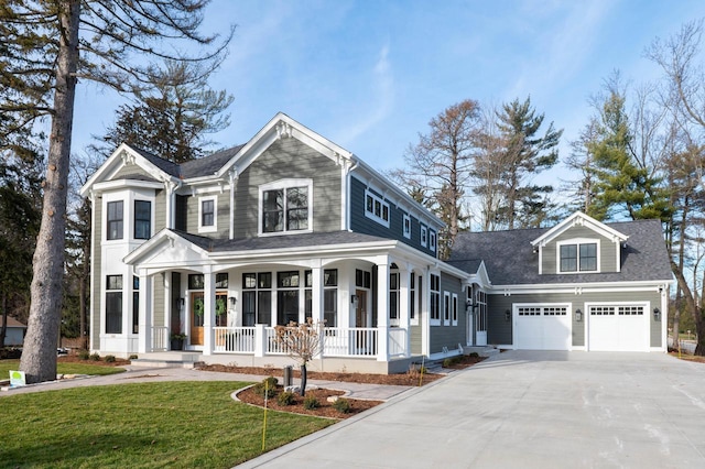 545 Wisconsin Ave, Delafield, WI 53018 - view of front of home featuring a garage, concrete driveway, a front yard, a shingled roof, and a porch