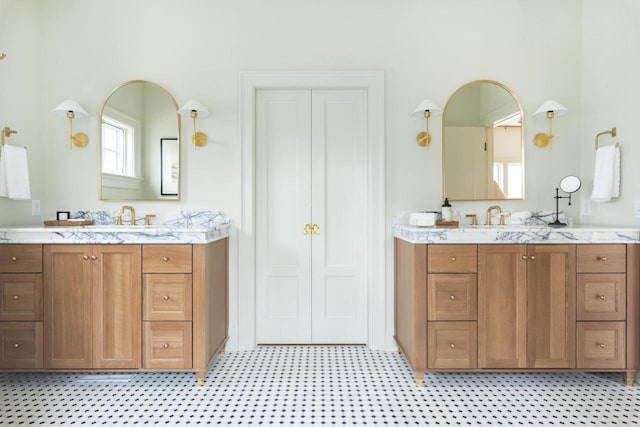545 Wisconsin Ave, Delafield, WI 53018 - bathroom with a sink, tile patterned floors, and two vanities