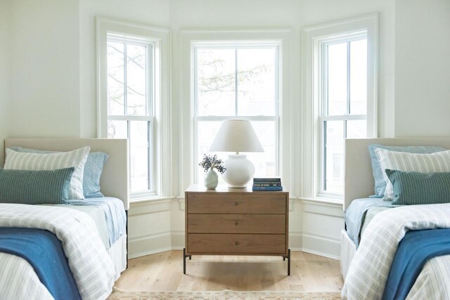 545 Wisconsin Ave, Delafield, WI 53018 - bedroom featuring baseboards and wood finished floors