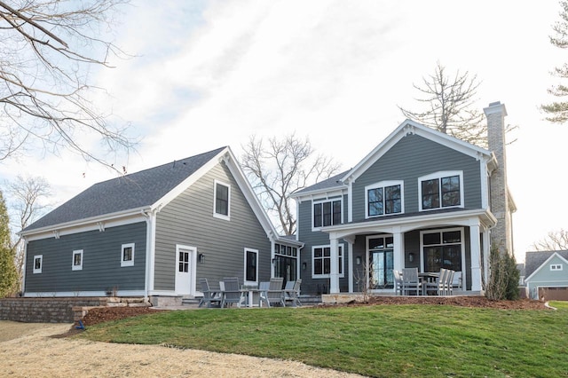 545 Wisconsin Ave, Delafield, WI 53018 - back of property with a lawn and a chimney