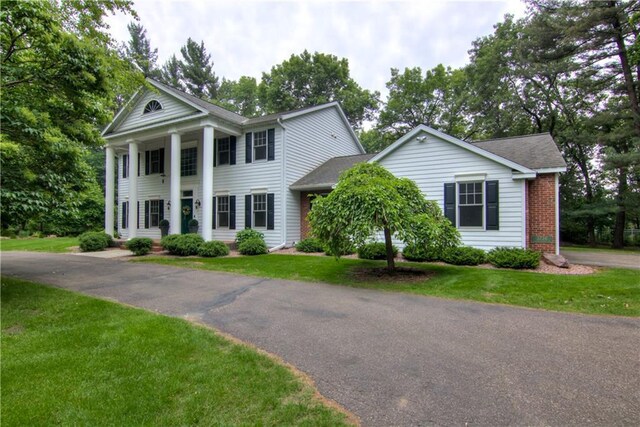 3736 Forest Knoll Dr, Eau Claire, WI 54701 - neoclassical / greek revival house with a front yard and brick siding