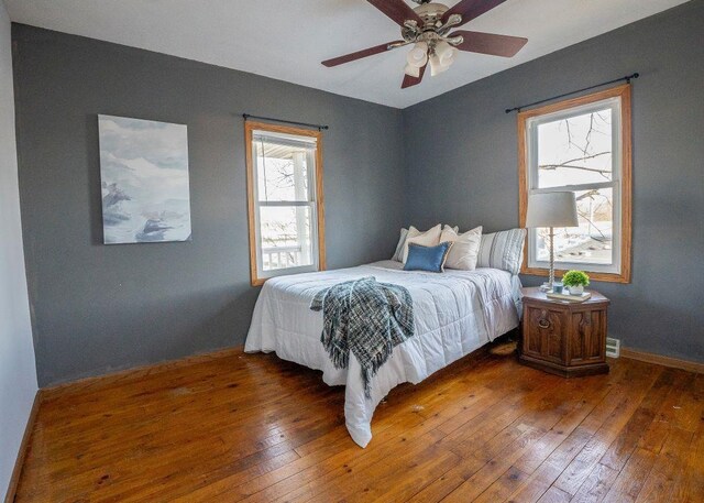 102 Highland St, Belmont, WI 53510 - bedroom with hardwood / wood-style flooring, baseboards, and a ceiling fan