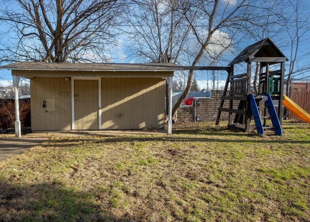 102 Highland St, Belmont, WI 53510 - view of shed featuring fence and a playground