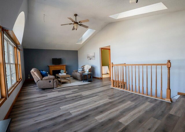 102 Highland St, Belmont, WI 53510 - sitting room with ceiling fan, a skylight, wood finished floors, an upstairs landing, and baseboards