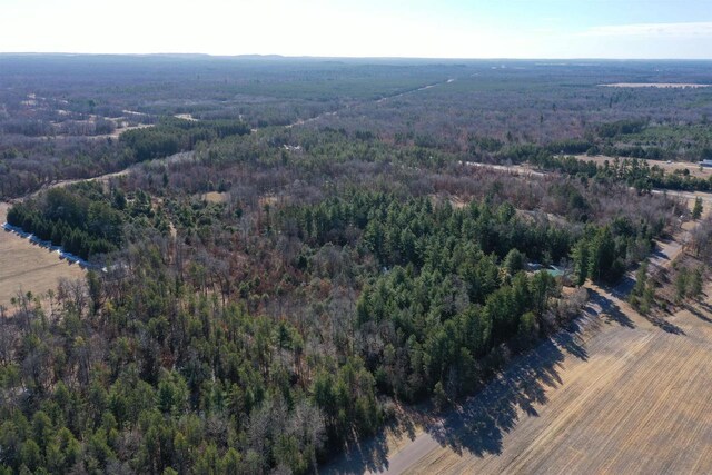 aerial view with a wooded view