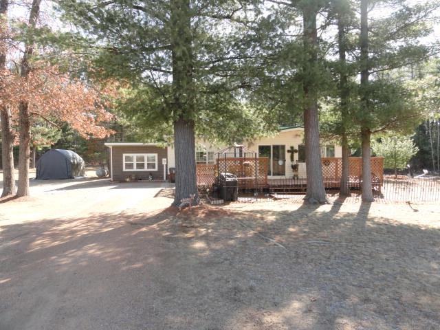 view of front of house with a wooden deck