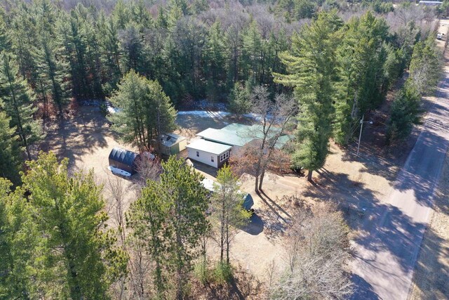 drone / aerial view featuring a view of trees
