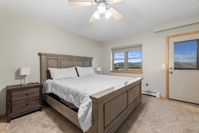 1646 N Friess Lake Dr, Hubertus, WI 53033 - bedroom with baseboards, light colored carpet, a ceiling fan, and a baseboard radiator