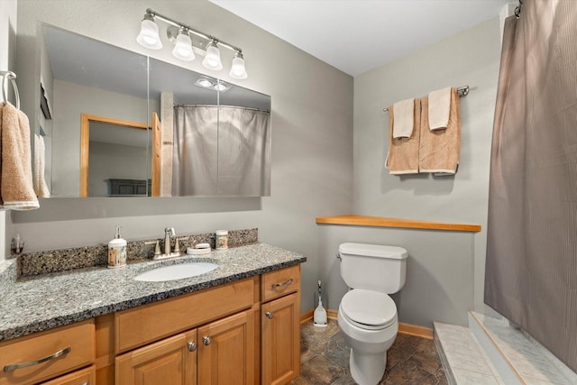 1646 N Friess Lake Dr, Hubertus, WI 53033 - full bath with a shower with curtain, toilet, vanity, and baseboards