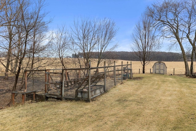 1646 N Friess Lake Dr, Hubertus, WI 53033 - view of yard with a garden, a storage unit, an outdoor structure, and a rural view