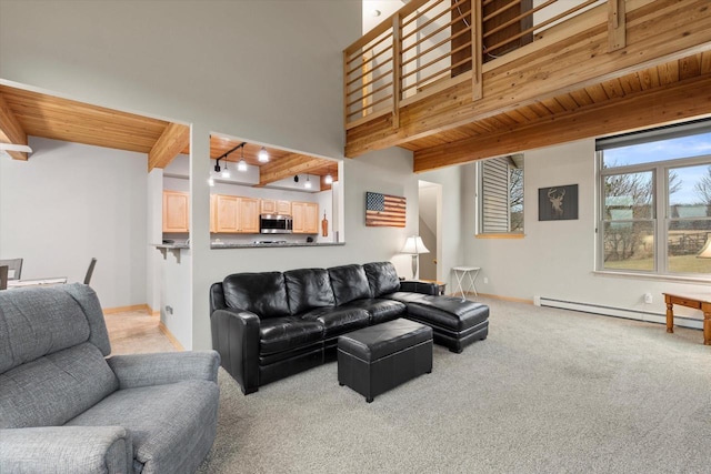 1646 N Friess Lake Dr, Hubertus, WI 53033 - living area featuring beam ceiling, wood ceiling, a baseboard radiator, baseboards, and carpet