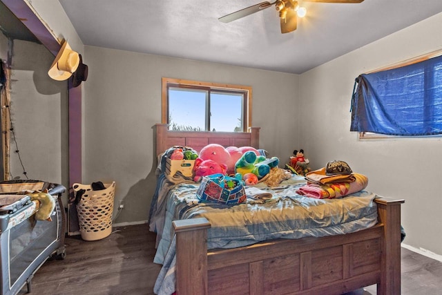 7760 State Highway 186, Arpin, WI 54410 - bedroom featuring baseboards, wood finished floors, and a ceiling fan