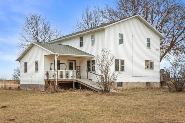 7760 State Highway 186, Arpin, WI 54410 - view of front facade with a front lawn, a chimney, a shingled roof, and a porch