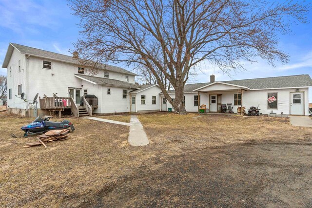 7760 State Highway 186, Arpin, WI 54410 - rear view of house featuring a chimney and a wooden deck