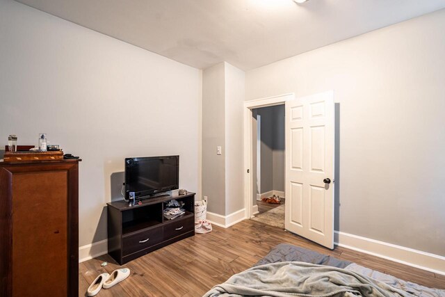 2214 N 40th St, Milwaukee, WI 53208 - bedroom featuring baseboards and wood finished floors
