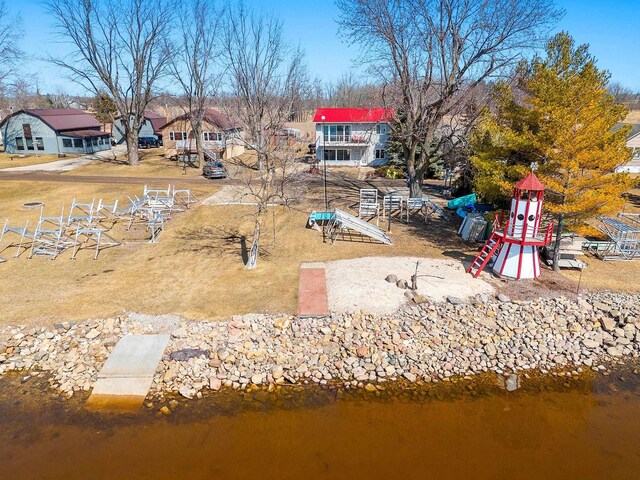birds eye view of property with a water view