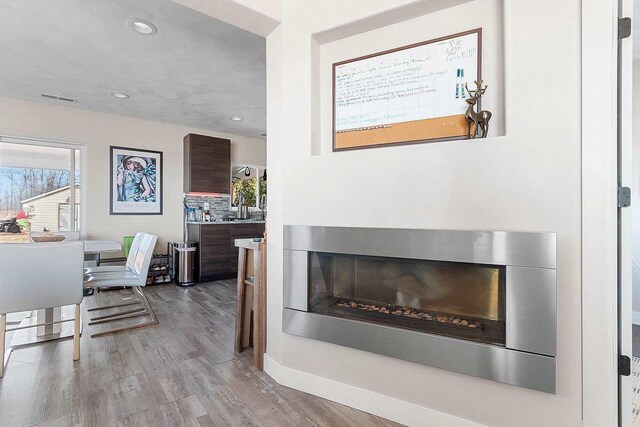 interior space with visible vents, wood finished floors, and recessed lighting