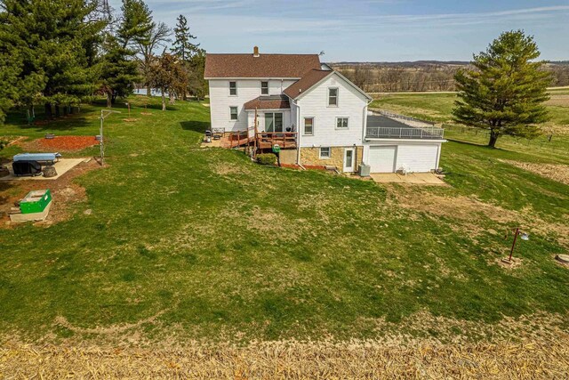 1943 State Road 11, South Wayne, WI 53587 - back of house featuring a yard and a garage
