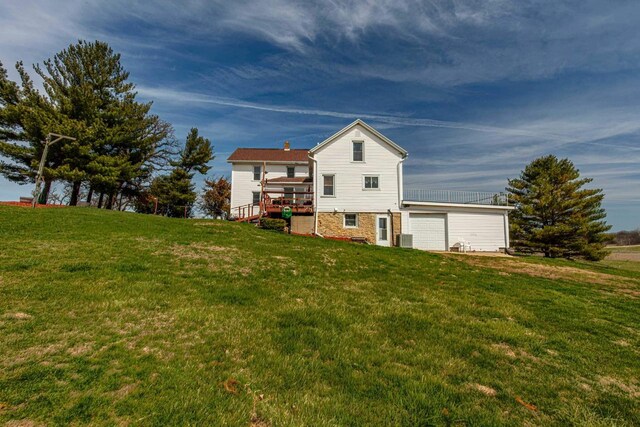 1943 State Road 11, South Wayne, WI 53587 - rear view of house with a wooden deck and a yard