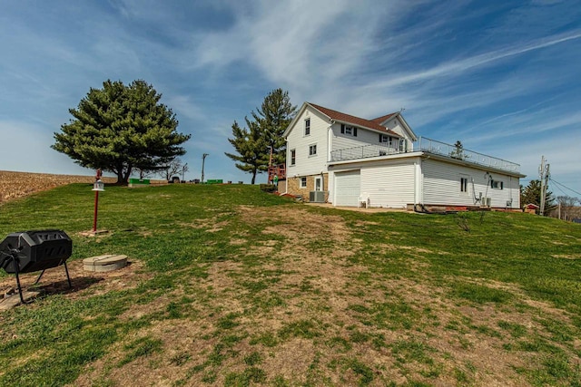 1943 State Road 11, South Wayne, WI 53587 - view of yard featuring an attached garage and cooling unit