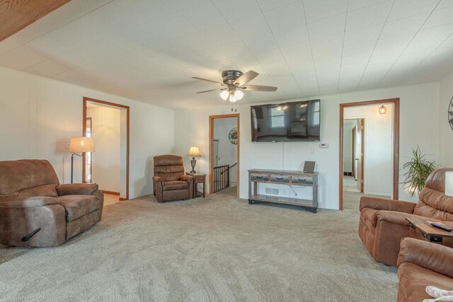 1943 State Road 11, South Wayne, WI 53587 - living area with carpet floors and ceiling fan