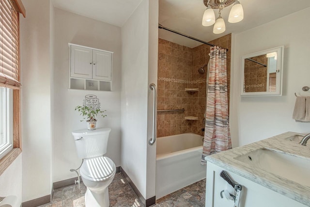 1943 State Road 11, South Wayne, WI 53587 - bathroom featuring toilet, baseboards, a chandelier, shower / tub combo with curtain, and stone finish flooring