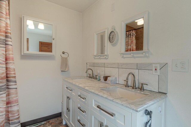 1943 State Road 11, South Wayne, WI 53587 - bathroom featuring a sink, double vanity, and tasteful backsplash