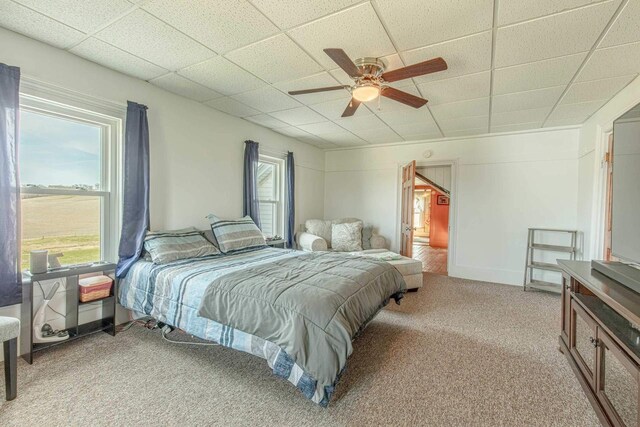1943 State Road 11, South Wayne, WI 53587 - bedroom featuring ceiling fan, a drop ceiling, and light carpet