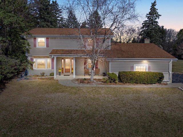 2925 Meadow Ln, Hartland, WI 53029 - back of house with a yard, brick siding, a patio area, and a chimney