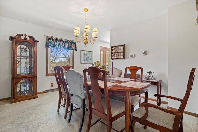 2925 Meadow Ln, Hartland, WI 53029 - dining room featuring light colored carpet, an inviting chandelier, and baseboards