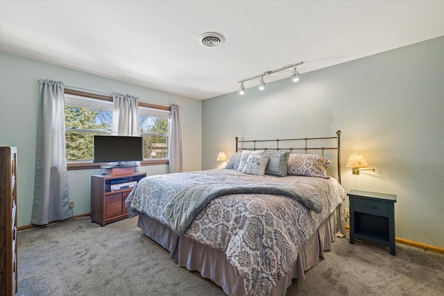 2925 Meadow Ln, Hartland, WI 53029 - carpeted bedroom with visible vents, baseboards, and track lighting