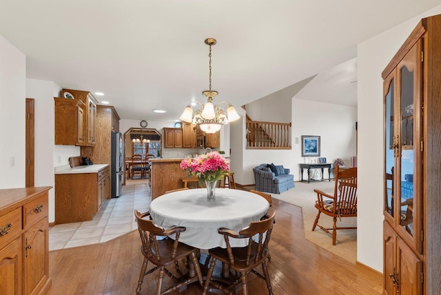 N8891 Gladstone Beach Rd, Fond Du Lac, WI 54937 - dining space featuring an inviting chandelier, recessed lighting, and light wood finished floors