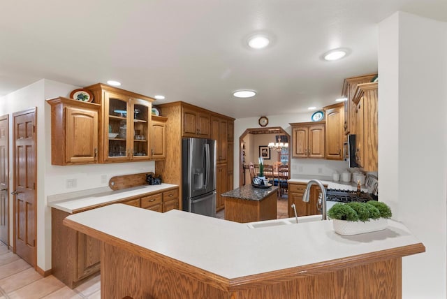 N8891 Gladstone Beach Rd, Fond Du Lac, WI 54937 - kitchen with a sink, brown cabinetry, stainless steel appliances, and recessed lighting