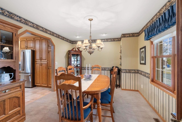 N8891 Gladstone Beach Rd, Fond Du Lac, WI 54937 - dining space with light colored carpet and a notable chandelier