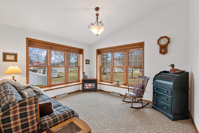 N8891 Gladstone Beach Rd, Fond Du Lac, WI 54937 - living area featuring visible vents, carpet, plenty of natural light, and vaulted ceiling