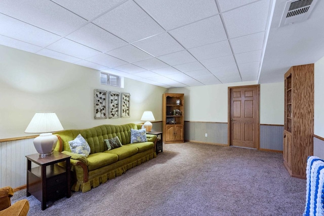 N8891 Gladstone Beach Rd, Fond Du Lac, WI 54937 - carpeted living room featuring visible vents, wainscoting, and a paneled ceiling