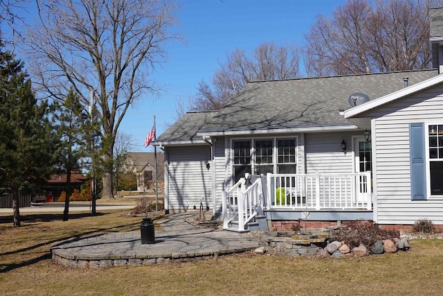 N8891 Gladstone Beach Rd, Fond Du Lac, WI 54937 - exterior space featuring a lawn and a shingled roof