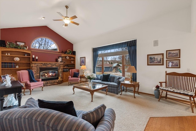 N8891 Gladstone Beach Rd, Fond Du Lac, WI 54937 - carpeted living area with visible vents, a brick fireplace, baseboards, high vaulted ceiling, and a ceiling fan