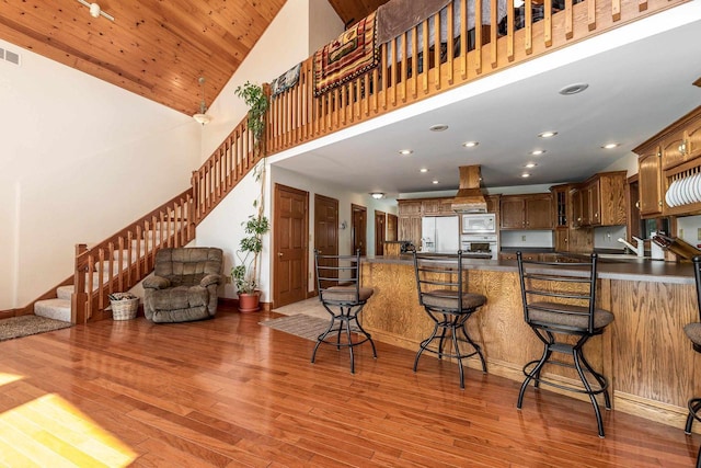 957 Whispering Ln, Hazel Green, WI 53811 - kitchen featuring a high ceiling, white fridge with ice dispenser, and light wood finished floors