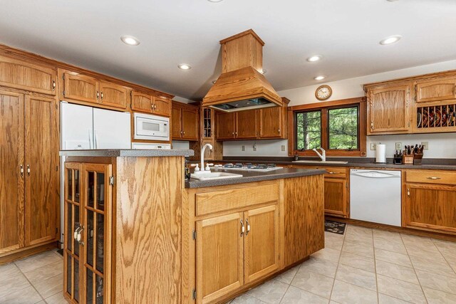 957 Whispering Ln, Hazel Green, WI 53811 - kitchen with an island with sink, a sink, island exhaust hood, white appliances, and recessed lighting
