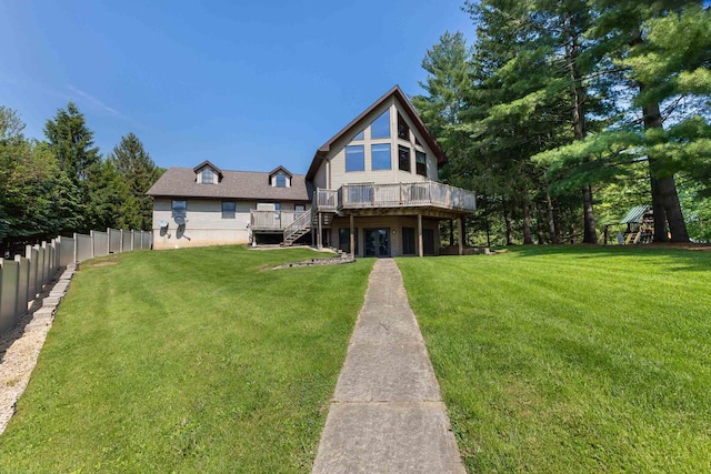 957 Whispering Ln, Hazel Green, WI 53811 - back of house with fence, stairway, a yard, and a wooden deck