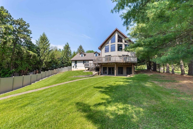 957 Whispering Ln, Hazel Green, WI 53811 - rear view of house featuring a wooden deck, fence, stairway, and a yard