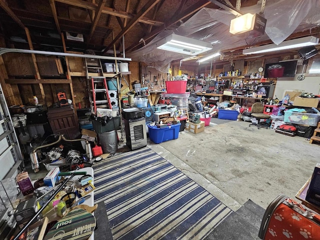 233 Highland St, Belmont, WI 53510 - garage featuring a workshop area and a garage door opener