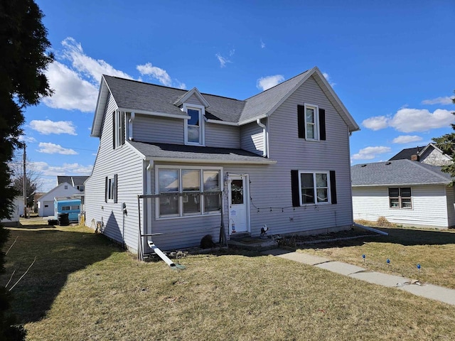 233 Highland St, Belmont, WI 53510 - traditional-style home with a front yard and a shingled roof
