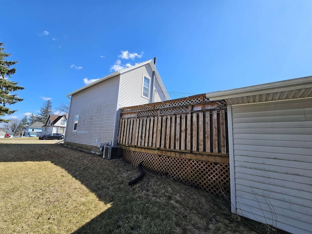233 Highland St, Belmont, WI 53510 - view of property exterior with a lawn, cooling unit, and a deck