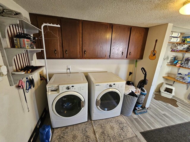 233 Highland St, Belmont, WI 53510 - laundry room with wood finished floors, washing machine and clothes dryer, cabinet space, and a textured ceiling